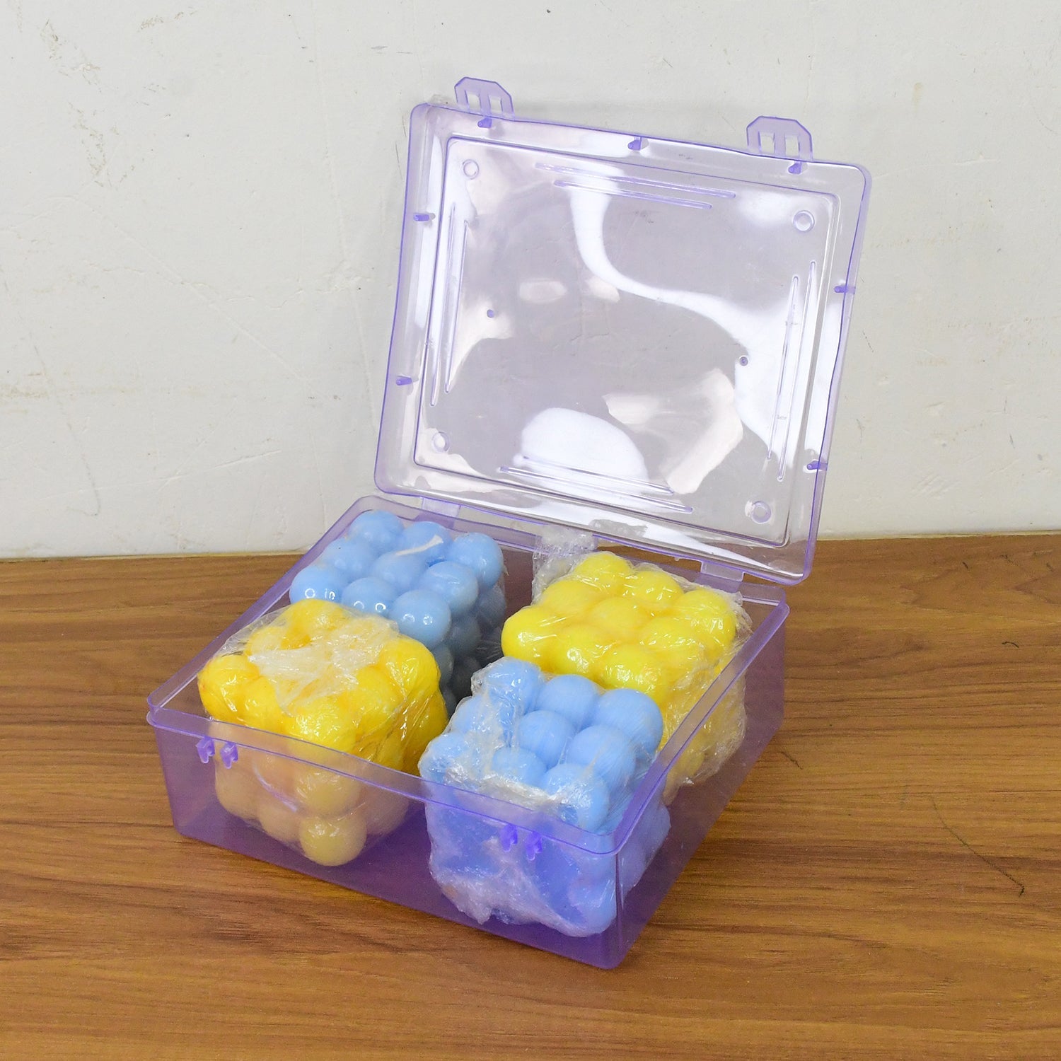 Cube wax candles lit to show calming and attractive decorative glow
