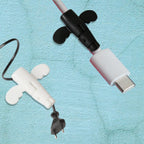 Angel silicone cable protector with a decorative butterfly wing pattern.
