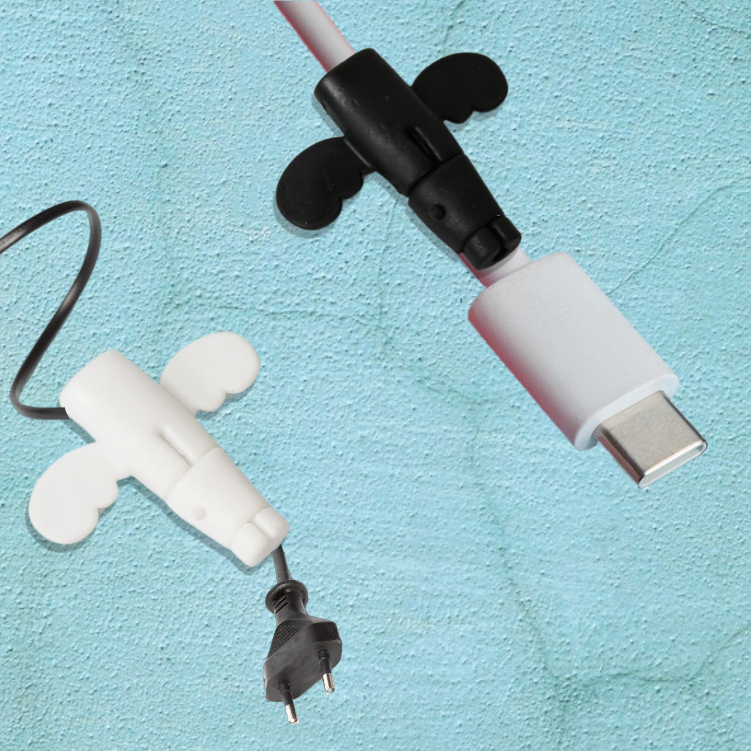 Angel silicone cable protector with a decorative butterfly wing pattern.