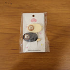 Model wearing the alphabet letter hair clips to accent casual hairstyle