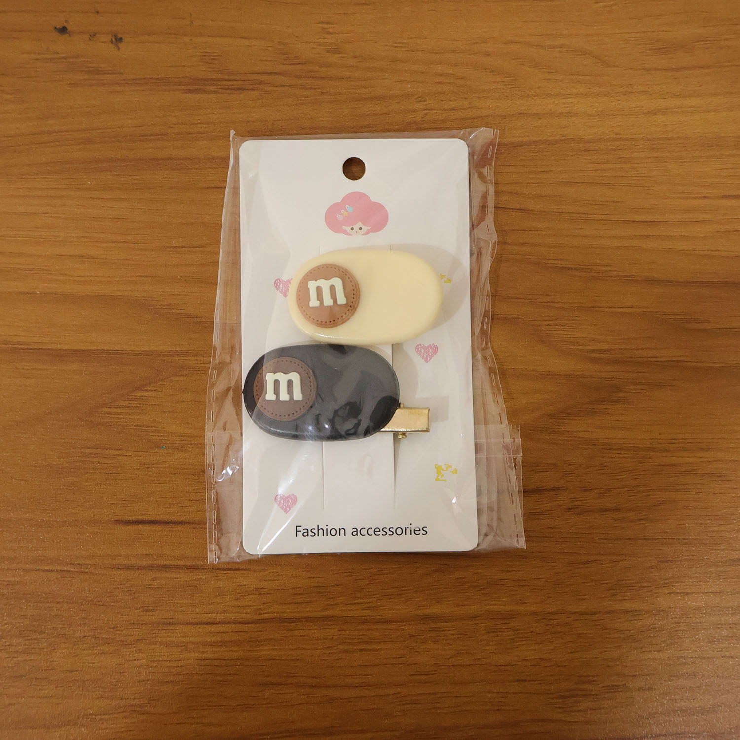 Model wearing the alphabet letter hair clips to accent casual hairstyle