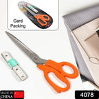 Close-up of ergonomic handles on tailor scissors, designed for comfortable grip during sewing.
