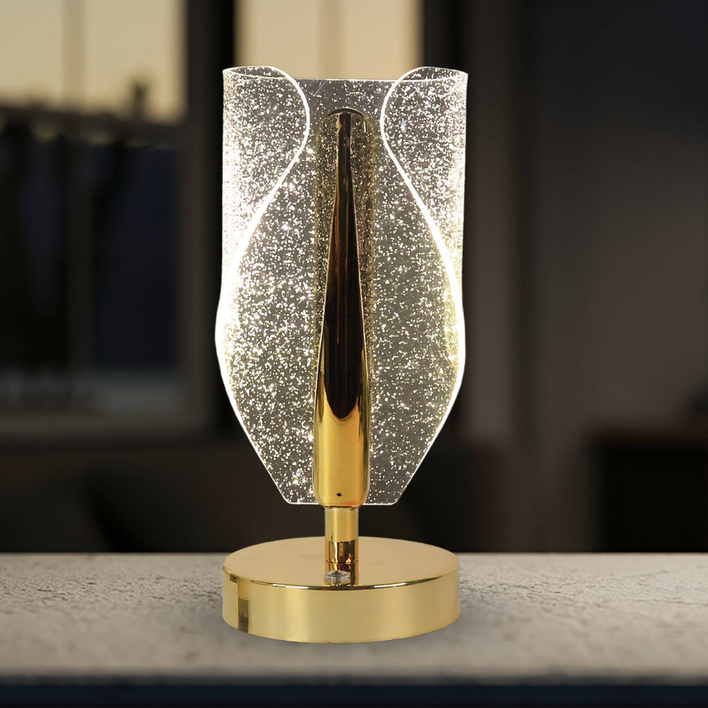 Side view of modern crystal table lamp with warm ambient light