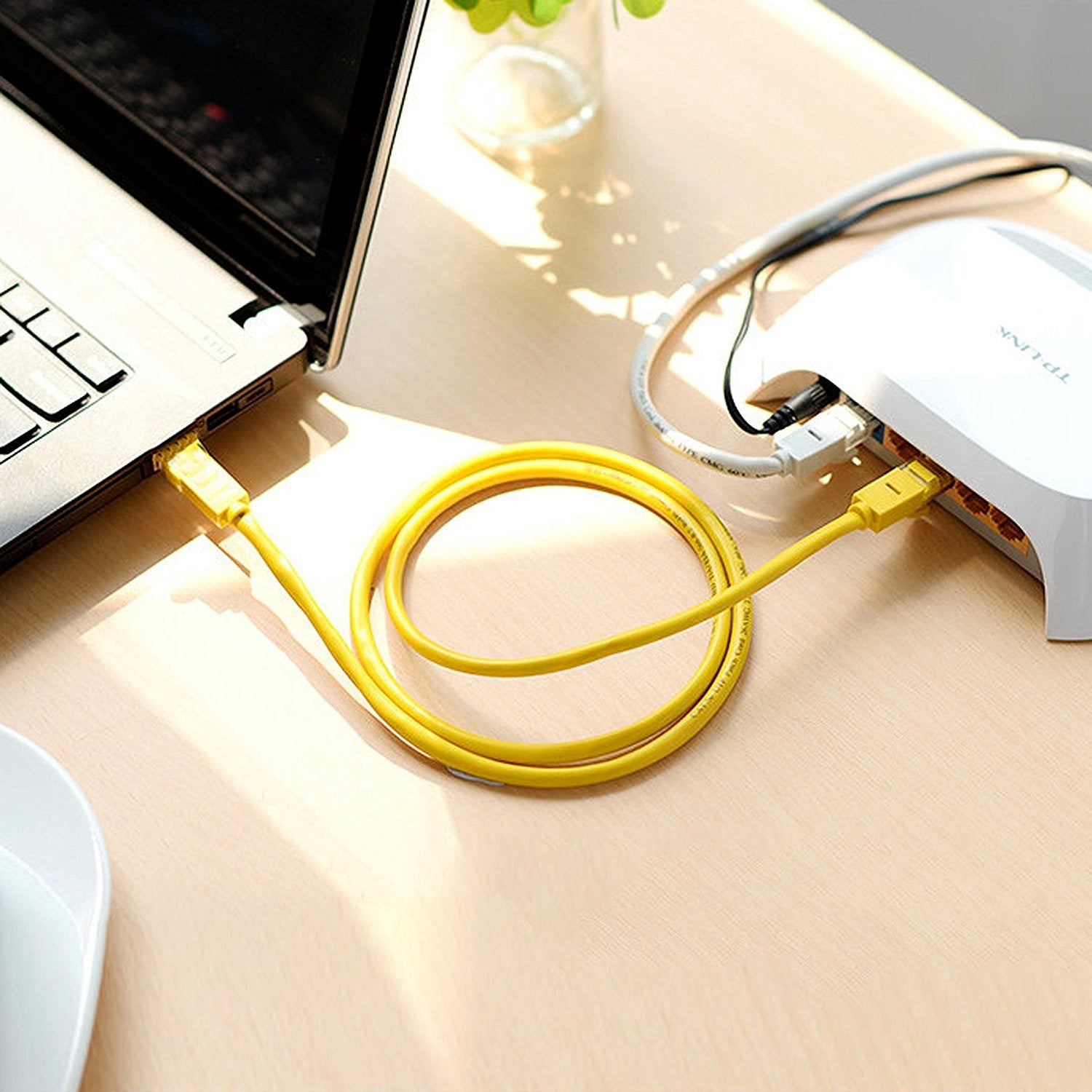 Close-up of CAT 5E Ethernet cable gold-plated RJ45 connector