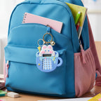 Bunny themed calculator keychain hanging with keys