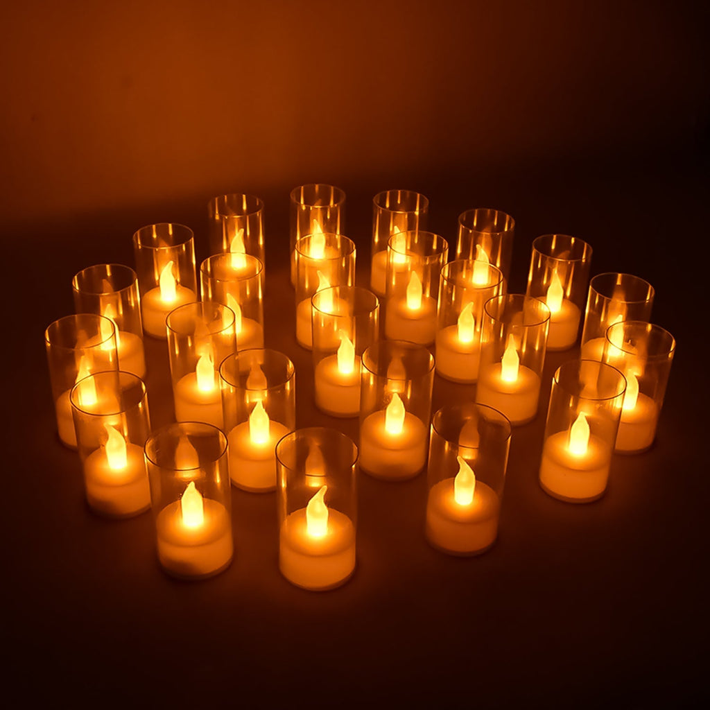Set of 24 LED flameless candles with transparent covers creating warm glow