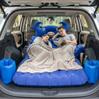 Vehicle interior with inflated inflatable car mattress and cushions