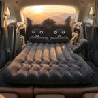 Black cat pillow on inflatable car mattress for comfort