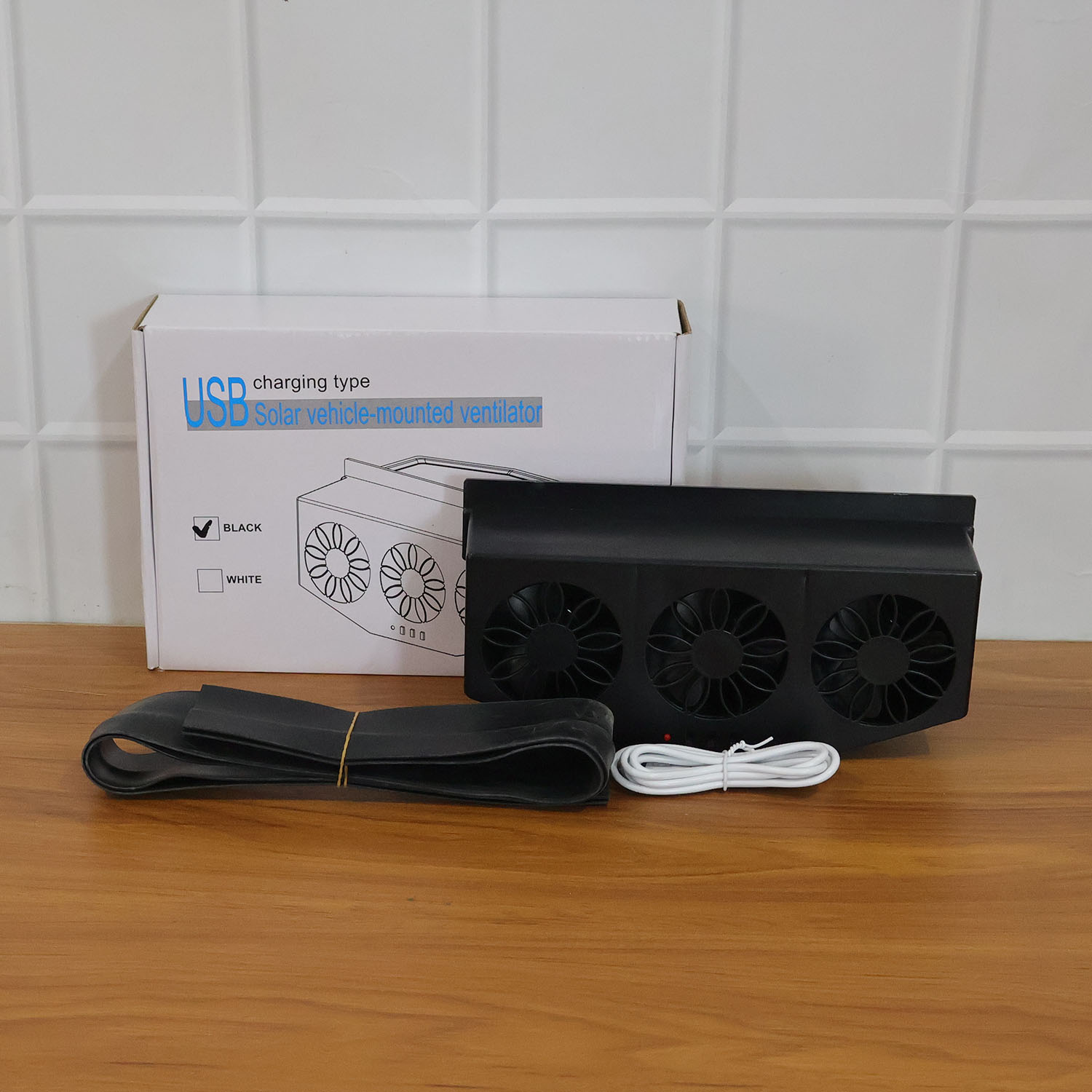 Triple fan car window exhaust ventilator installed for sun-exposed parking
