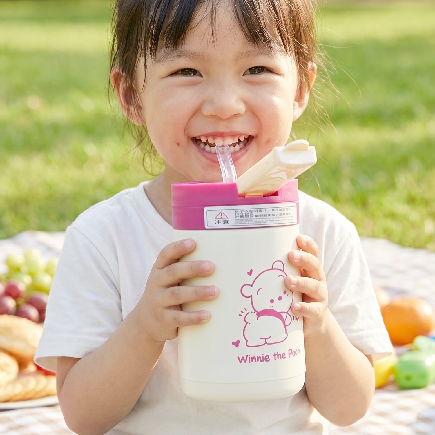 Kids drink tumbler with cartoon print, lid, and straw for safe drinking