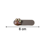 Neutral image showing size comparison of bunny face decorative hair clips