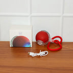 Interactive cat toy ball showing USB charging port and included cable
