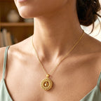 close-up image of golden necklace chain links with intricate design