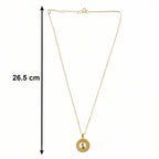 angled view of golden necklace chain and intricate pendant