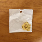 golden pendant with intricate patterns highlighting elegant design
