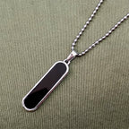 Close-up of matching sleek chain included with minimalist bar pendant necklace