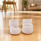 Anti-scratch silicone feet pads on wooden floor under furniture legs