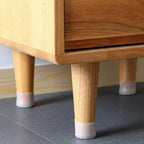 Silicone furniture pads fitted on chair legs for floor protection