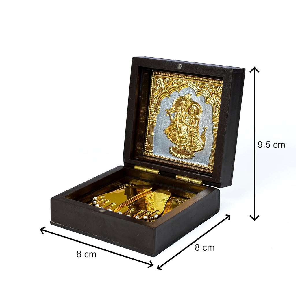 Detailed view of ornate Radha Krishna embossed metal art on wooden box lid