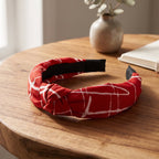 Knotted red and white patterned hairband