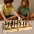 Close-up of the finely crafted wooden chess pieces, showcasing their polished finish and detail.