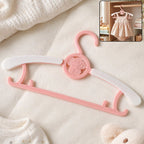 Colorful plastic kids clothes hanger with playful design