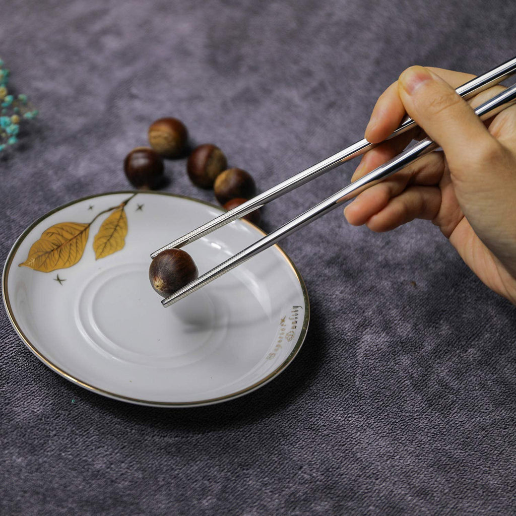 Angled view showcasing the polished finish of stainless steel dining chopsticks.
