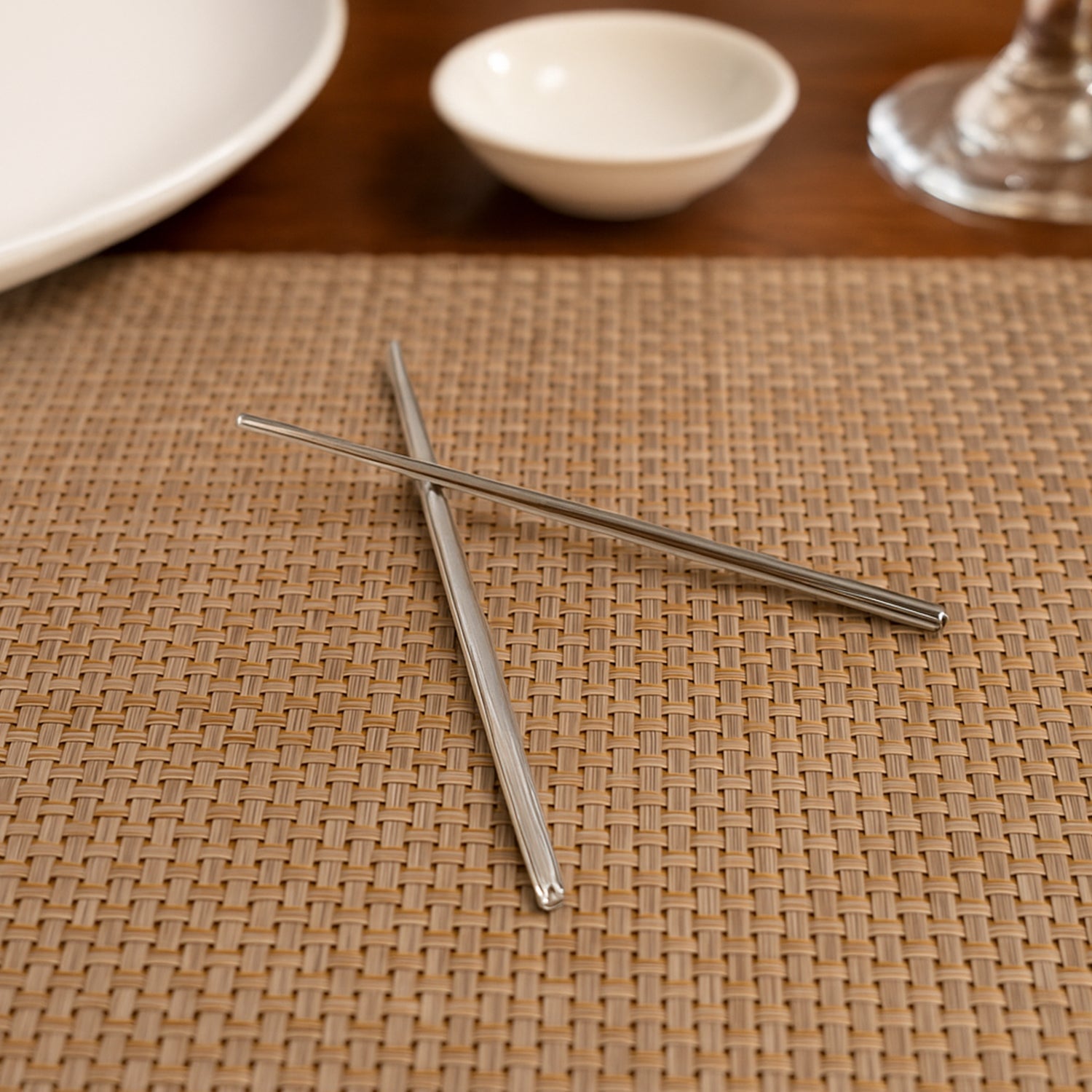 Detailed close-up of the textured tips of stainless steel chopsticks.