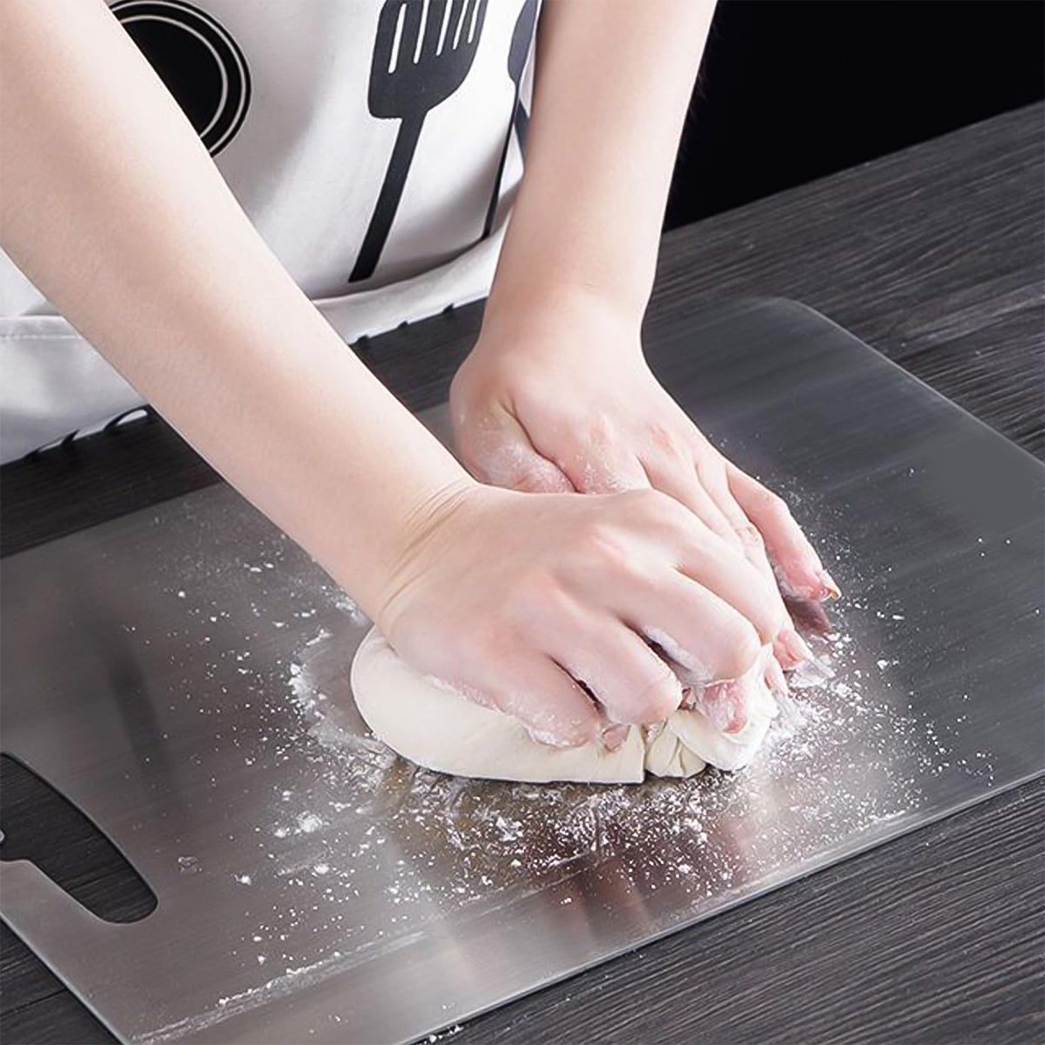 Smooth surface on stainless steel cutting board preventing knife dulling