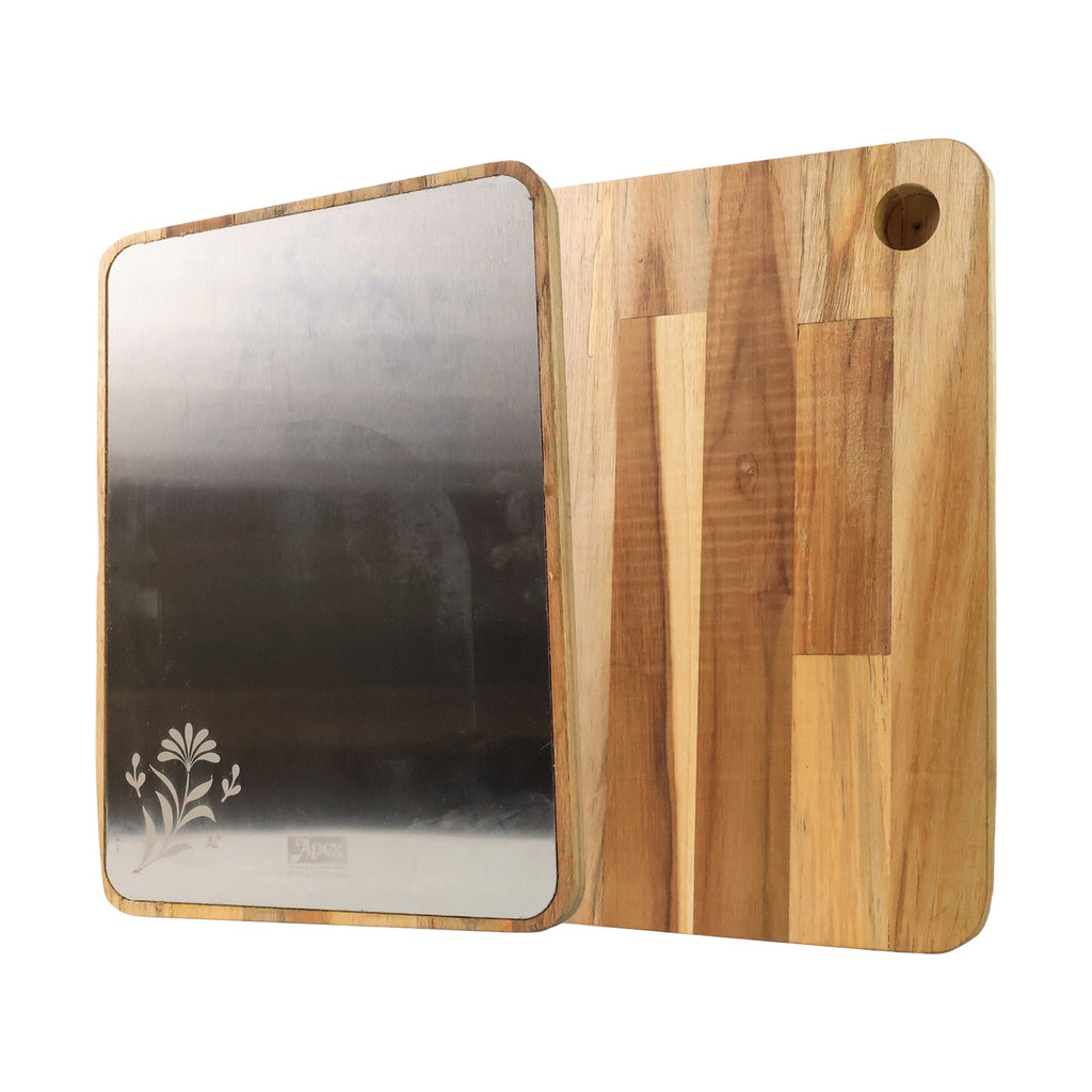 Steel oak cutting board on countertop with freshly chopped vegetables