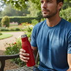 Close-up of leakproof screw cap on red stainless steel bottle