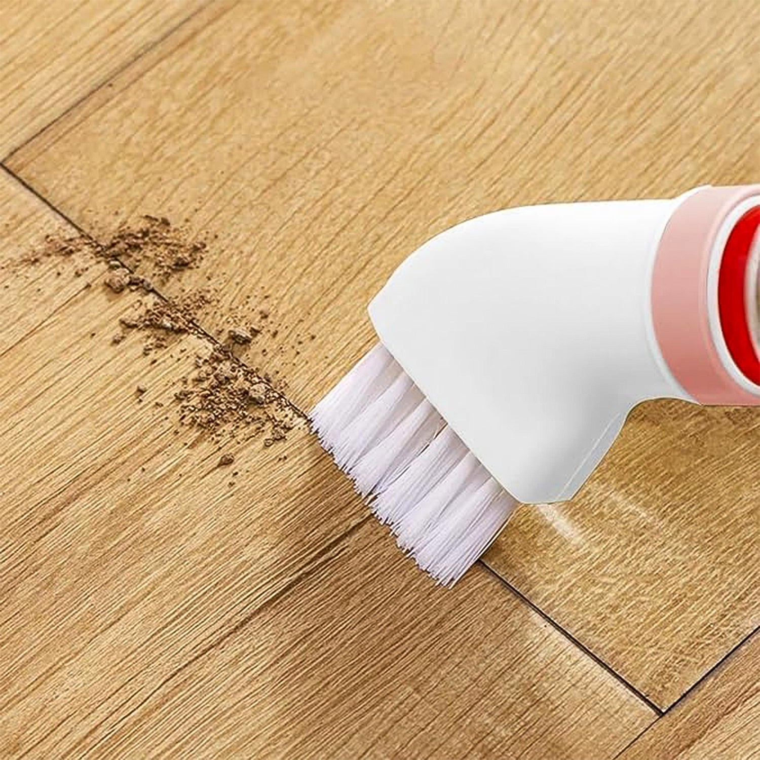 Bottle-attachable cleaning brush in use on kitchen sink surface