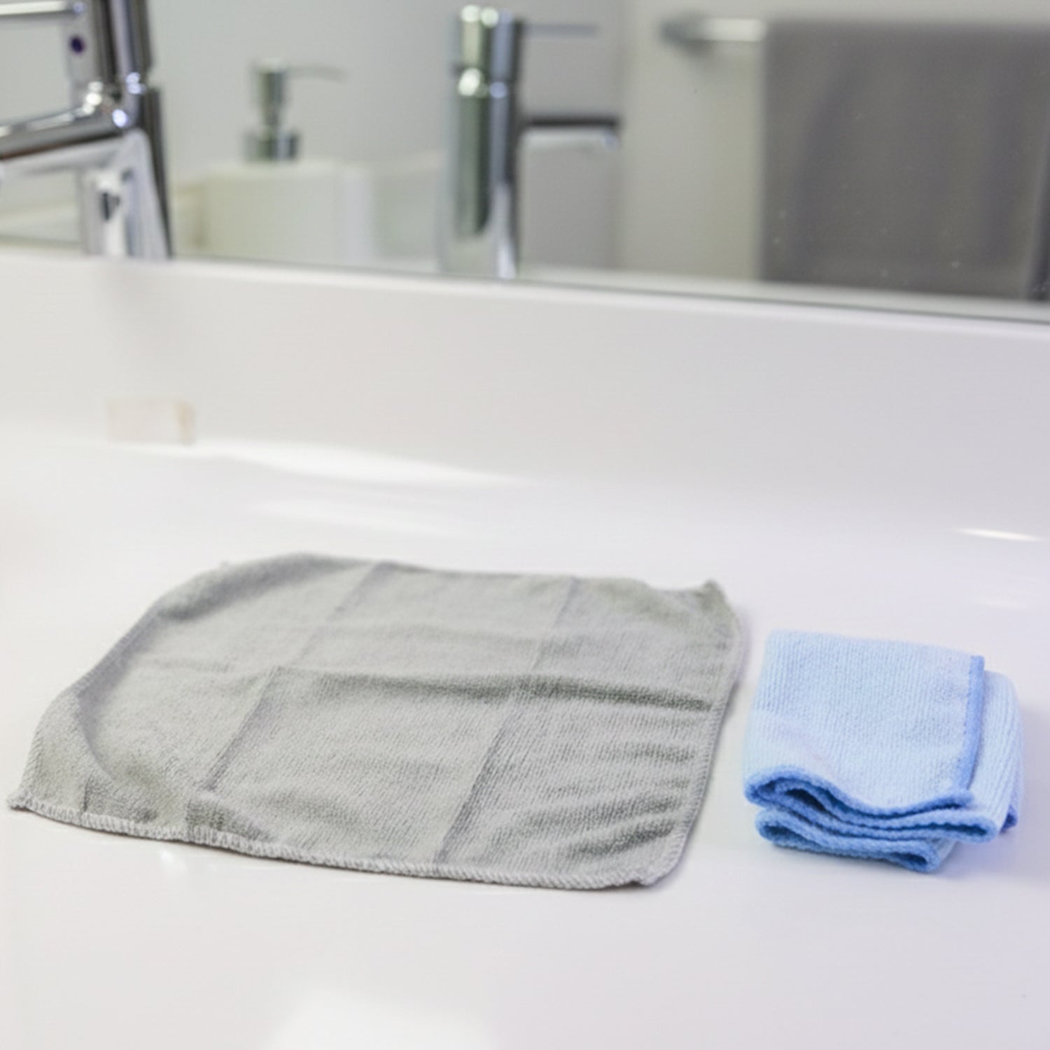 Set of 5 microfiber cleaning cloths displayed on wooden surface
