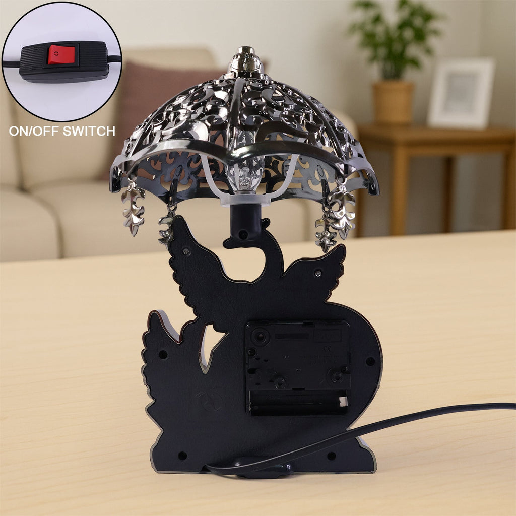 Side view of heart-motif table lamp with analog clock