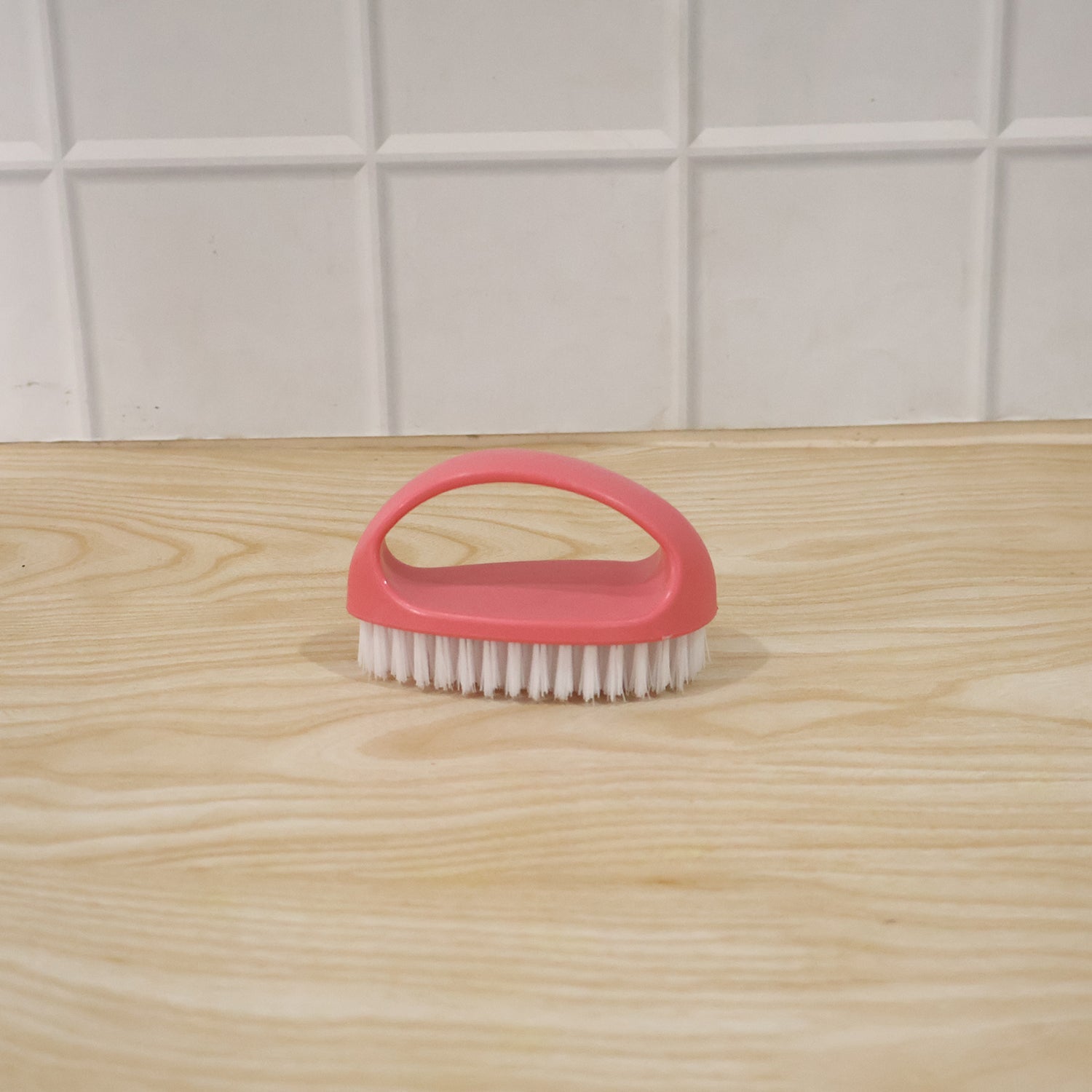 Person using multi-purpose cleaning brush on surface for deep cleaning