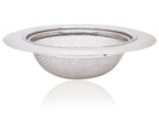 Stainless steel sink strainer seamlessly installed in a modern kitchen basin.