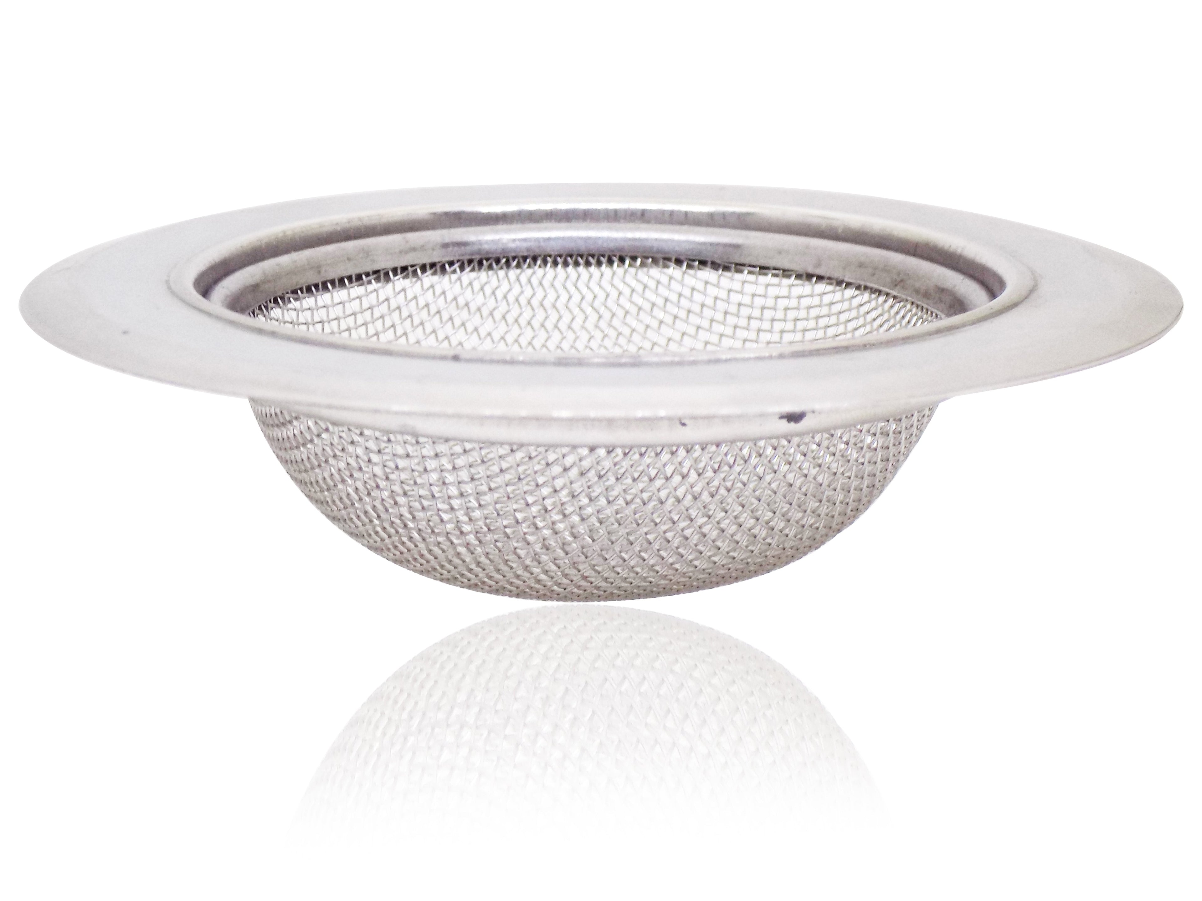 Stainless steel sink strainer seamlessly installed in a modern kitchen basin.