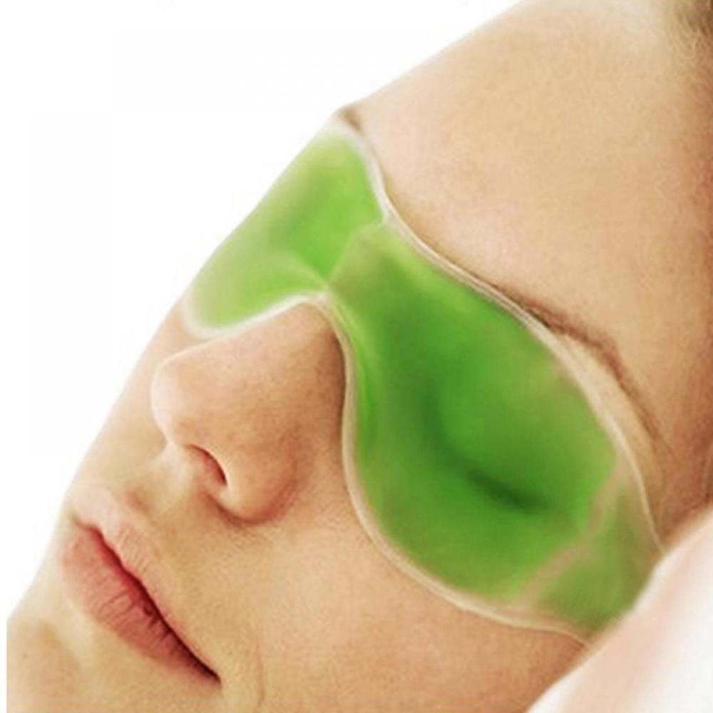Green gel eye mask with cooling effect, perfect for reducing puffiness.