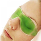 Green gel eye mask with cooling effect, perfect for reducing puffiness.