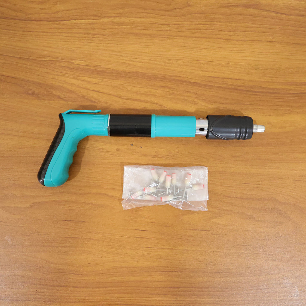 Demonstration of manual nail gun fastening on wall surface