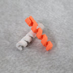 Soft silicone cable protector hugging a data cable, showcasing its snug fit.