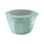 Ergonomic manual vegetable grater with clear integrated collection bowl