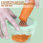 Compact manual vegetable grater showing corn kernels collected in storage bowl
