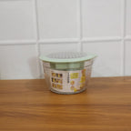 Lifestyle image of manual vegetable grater used in preparing healthy meal