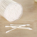 Cotton ear buds placed inside a clear storage jar for cleanliness