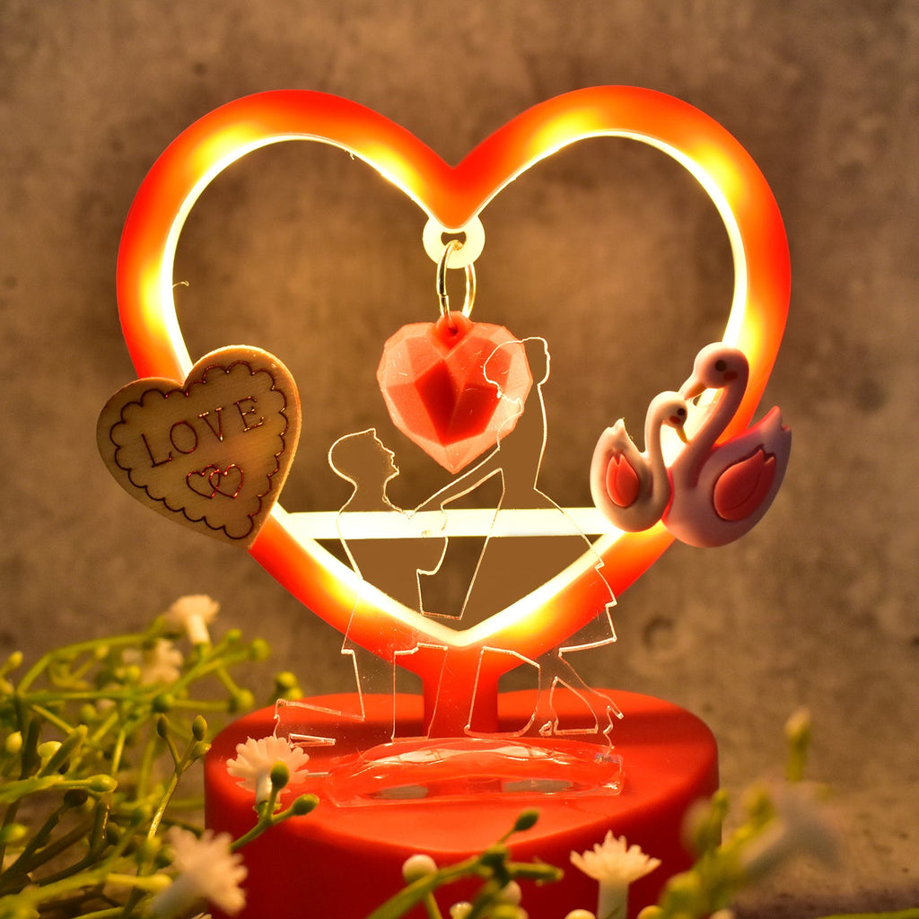 Full view of love heart-shaped decorative showpiece with LED illumination