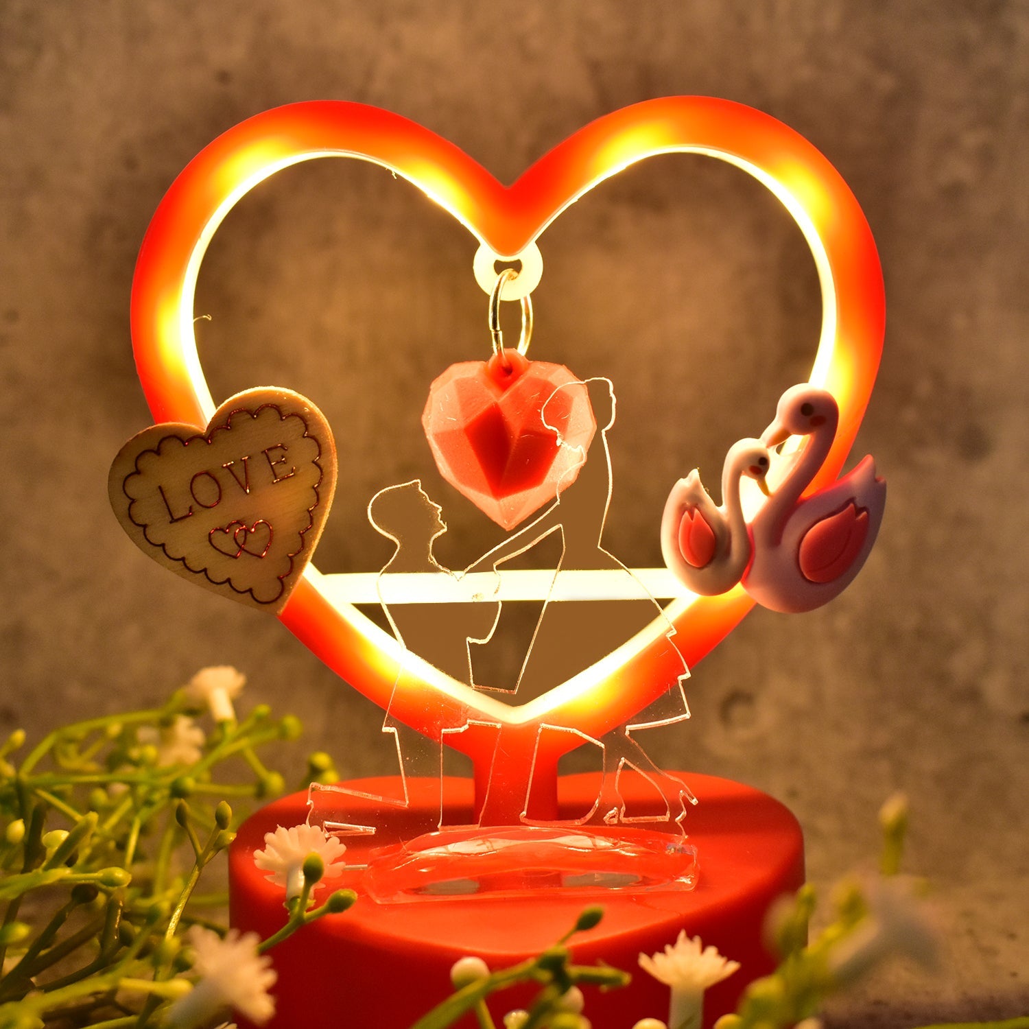 Full view of love heart-shaped decorative showpiece with LED illumination