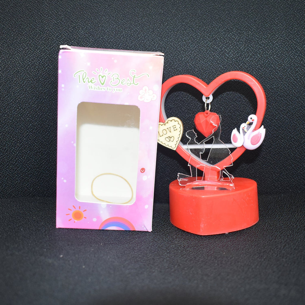 Back view of heart showpiece illuminated by LED light glowing warmly