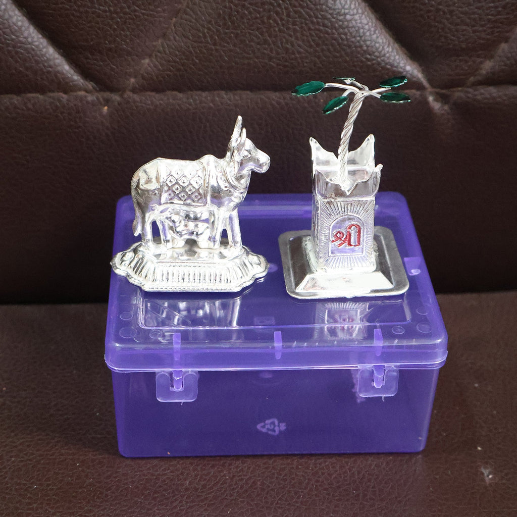 Sacred Kamdhenu cow and Tulsi plant silver-plated pooja items for home altar