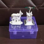 Sacred Kamdhenu cow and Tulsi plant silver-plated pooja items for home altar